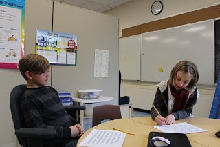 boy and girl working in the classroom