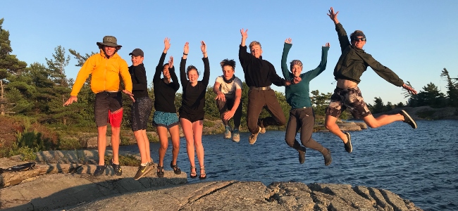 students jumping into the air